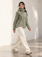 Storm Shell — Leopard, Dusty Sage — worn outdoors